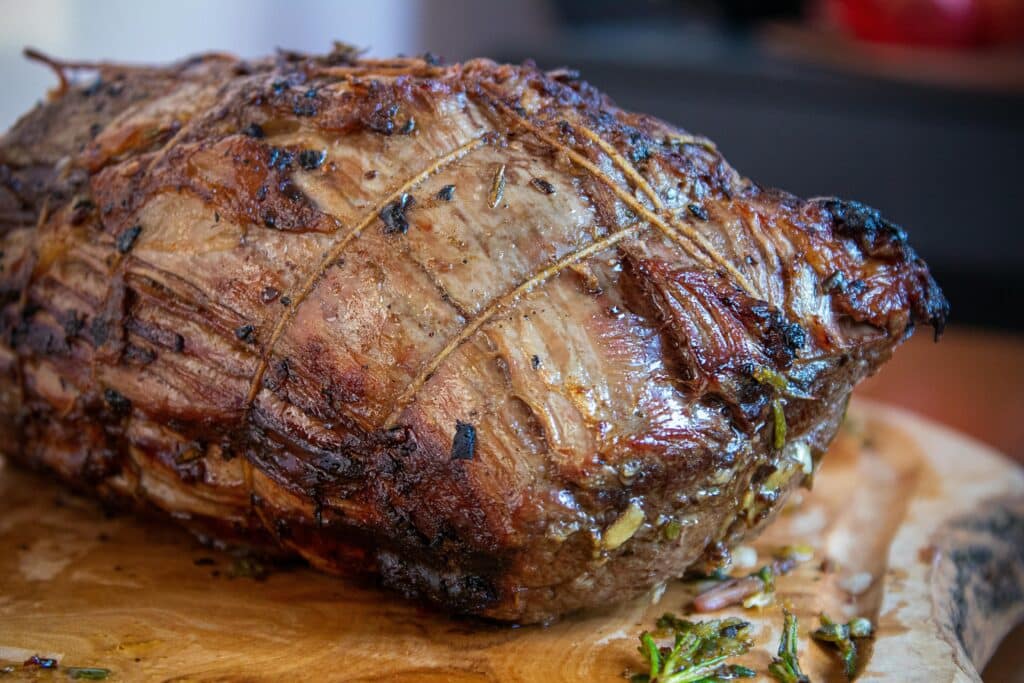 Deliciously roasted beef seasoned with herbs, perfect for festive gatherings.