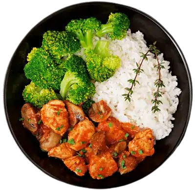 Chicken Stew with Steamed Broccoli and White Rice A black bowl containing a meal of steamed broccoli florets, fluffy white rice garnished with a sprig of thyme, and chunks of chicken stew in a red tomato-based sauce with mushrooms, arranged in neat sections.